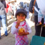 Cutie pie eating chips at the irrigation water event.
