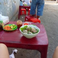 Early breakfast Pho in an alley on the way out of Saigon