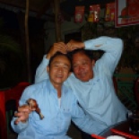 I was drinking my Angkor and eating dinner alone, and afterward a bunch of guys from the Electorate of Cambodia handed me another beer and invited me to sit with them. Their buddy holding the chicken leg here is actually Vietnamese and they kept making fun of him. Good times with beer and Khmer flash cards!!