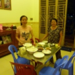 Venny's mom and sister Muoyheak, with the delicious dinner they made! Green beans, ginger fish, pickled cabbage... so good.