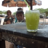 Fresh pressed cane palm juice... I made myself go a whole hour before I could stop for one of these icy beverages. Or three. If course I had water in my water bottles, but it was hot water after only a few minutes so I made a lot of short stops for cold drinks. These kids were cute, and helped me practice some Khmer.