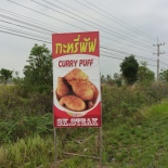 Often, road signs are the highlights of my rides. This was one of about 100 signs that said "STEAK." Curry puff sounded good, but I didn't stop.