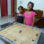 Back at the homestay, Suhan and Sumana (daughters of the owners) showed me how to play carom. They schooled me of course but it was fun.