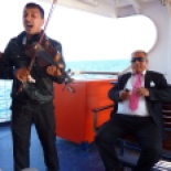 On the ferry to Bozcaada island (pronounced "bo-JAH-da")... I couldn't believe that this dude in the pink tie AND the traveling musician came together in the same ridiculous photo for me. Thanks, guys.